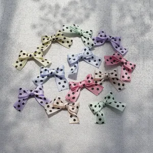 Detailed macro view of assorted colorful polka dot ribbon bows for DIY craft accessories
