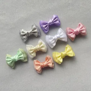 Set of eight double-layered satin bow hair clips in vibrant macaron colors with lace details