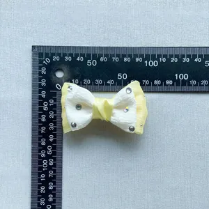 Detailed view of 45mm crystal rhinestone double-layer fabric bow accessory with scale ruler