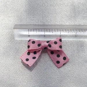Pink polka dot ribbon bow accessory for DIY crafts and hair clips measures 2.8cm wide