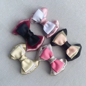 Detailed view of layered ribbon bow accessories in diverse colors for DIY fashion projects