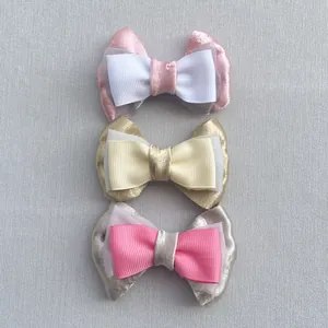 Detailed view of handmade multi-layer ribbon bow accessories for DIY hair clips and crafts