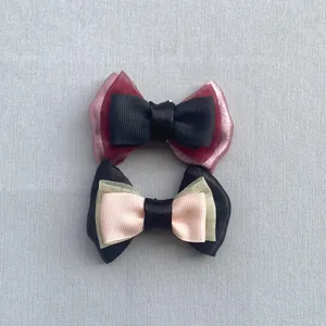 Close-up of multi-layer ribbon bows with lace and satin textures for DIY accessories
