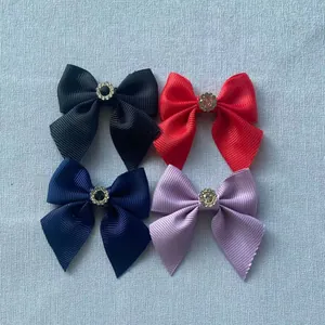 Detailed set of four grosgrain ribbon bow accessories with crystal rhinestone center decor