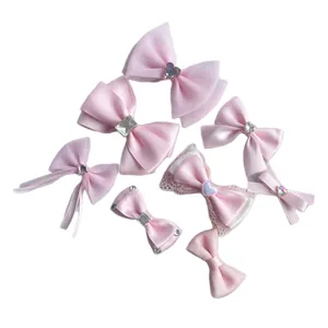 Handmade pink ribbon bow set with assorted satin and lace fabric hair accessories