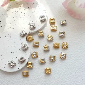 Detailed macro view of assorted Italian charms with bear motifs for modular bracelets