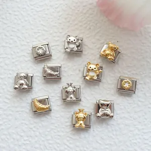 Detail view of Italian charm links with teddy bear and croissant motifs in gold and silver