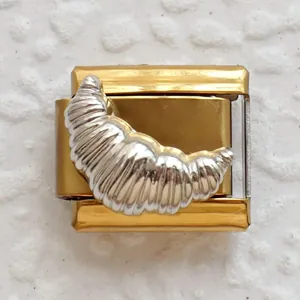 Italian charm link featuring a silver croissant design on a golden stainless steel base