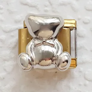Close-up of dual-tone Italian charm featuring a silver teddy bear on a gold base