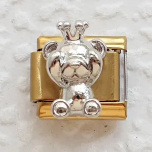 Detailed close-up of a silver crown bear charm on a gold Italian modular bracelet link