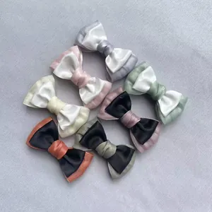 Detailed view of six DIY Morandi multi-layer satin and organza bow accessories