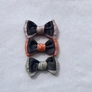 Vertical view of Morandi color satin ribbon bows for DIY accessories in three colors