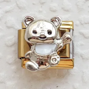 Detailed close-up of a golden Italian charm link with a silver and white panda pendant