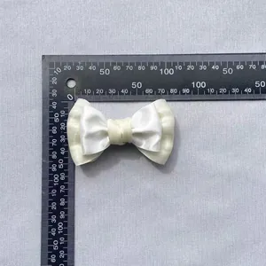 Morandi cream double-layered satin and organza bow accessory with measurement ruler