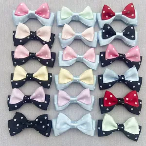 Detailed view of 18 colorful double-layered polka dot handmade bow clips for DIY hair accessories