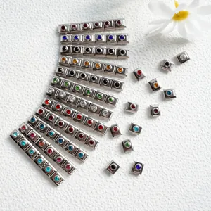 Macro view of colorful crystal birthstone charms for Italian modular bracelets