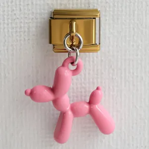 Bracciale modular italiano con ciondolo a forma di cane palloncino rosa su maglie dorate