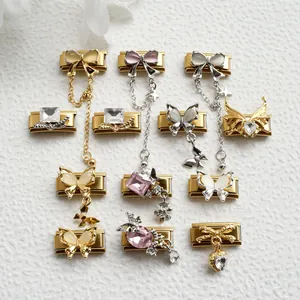 Detailed close-up of stainless steel Italian modular charms featuring butterfly and crystals