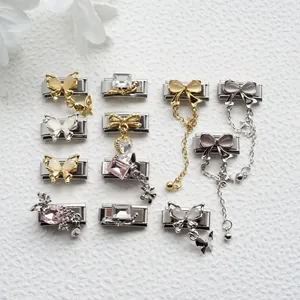Detailed close-up of butterfly and gemstone charms on stainless steel Italian bracelets
