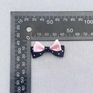 Handmade double-layered pink and black polka dot bow accessory measuring 4cm for DIY crafts