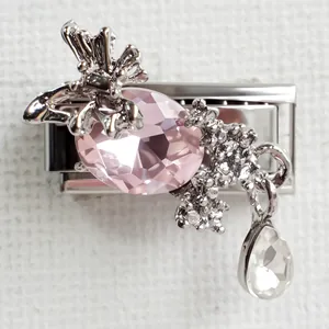 Detail of Italian charm link featuring pink butterfly crystal and silver metal finish