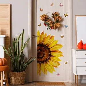Self-adhesive sunflower and butterfly wall decals applied on a wooden door decor
