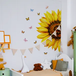 Detail of vibrant sunflower and colorful butterfly wall stickers in a cozy bedroom setting