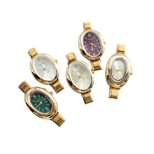 Women's gold oval quartz wristwatches with multiple dial colors and metal link straps