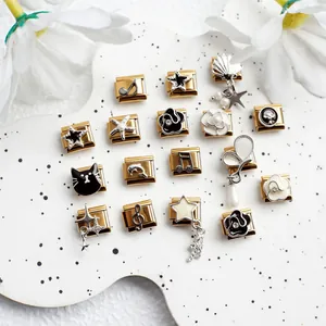 Detailed close-up of 304 stainless steel Italian charms with black and white floral motifs