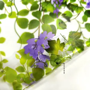 Close-up of wisteria floral window stickers with double-sided colorful plant patterns