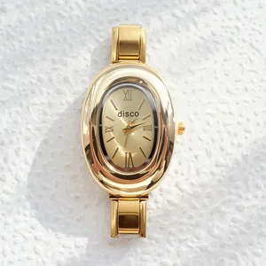 Vintage gold oval quartz watch with disco brand dial and metal link chain strap