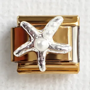 Macro shot of gold Italian charm link featuring a silver starfish and white pearls