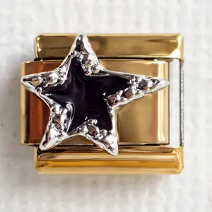 Macro shot of 304 stainless steel Italian charm with golden finish and black enamel star