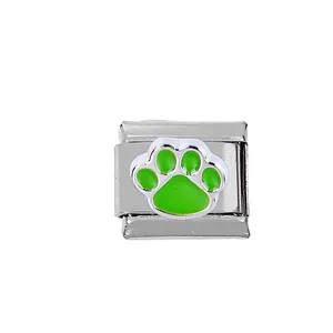 Macro detail of 304 stainless steel Italian charm link with green enamel dog paw print