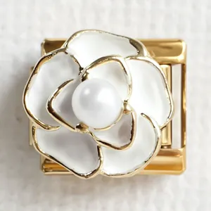 Italian charm bracelet link with golden finish featuring a white camellia and pearl center