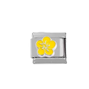 Macro view of 304 stainless steel modular charm with yellow flower enamel for DIY bracelets