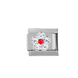 Macro view of modular flower charm with white and red crystals on stainless steel base