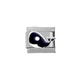 Detail of stainless steel modular link charm featuring a black and white whale design