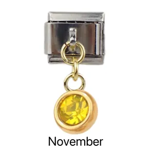 Detail of November birthstone charm with yellow gemstone for Italian charm bracelets