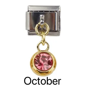 Detail of Italian modular charm with October pink birthstone in gold and silver setting