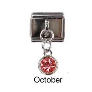 Close-up of Italian charm with pink October birthstone and polished stainless steel link