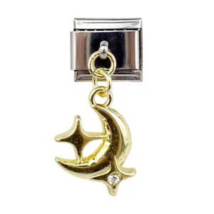 Macro detail of Italian charm link featuring gold crescent moon and star with crystal