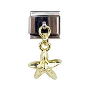 Close-up of golden starfish charm pendant on stainless steel Italian modular bracelet link