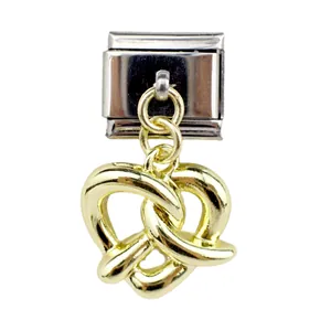 Detail of stainless steel link charm with gold pretzel pendant for DIY jewelry