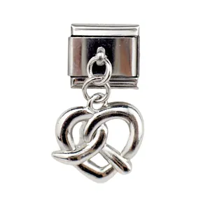 Macro view of silver heart pretzel charm on stainless steel Italian link bracelet