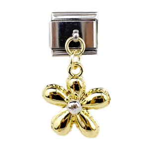 Detailed close-up of a gold five-petal flower charm on an Italian modular link