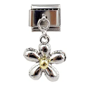 Detail showing an Italian charm with silver flower pendant and gold center for DIY jewelry