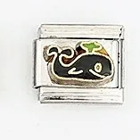 Macro detail of Italian charm bracelet link featuring a black whale enamel design