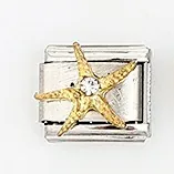 Detail of Italian charm bracelet link featuring a golden starfish and small rhinestone