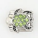 Detailed view of Italian charm link featuring a green crystal sea turtle on stainless steel